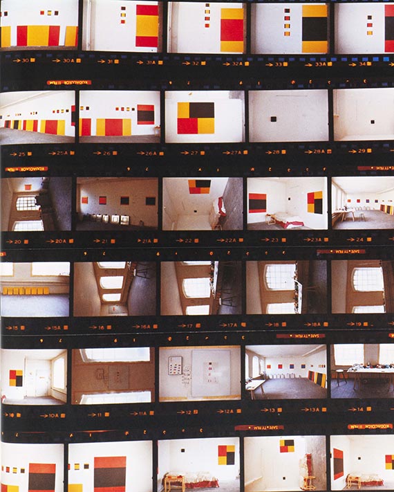 Illustration for: Palermo's studio in Düsseldorf, 1977, taken by Imi Knoebel immediately after Palermo's death. On the walls next to Palermo's “To the people to New York City” are the last two paintings, “Untitled (4 parts)” and “Untitled (8 parts)”. © VG Bild-Kunst, Bonn 2025